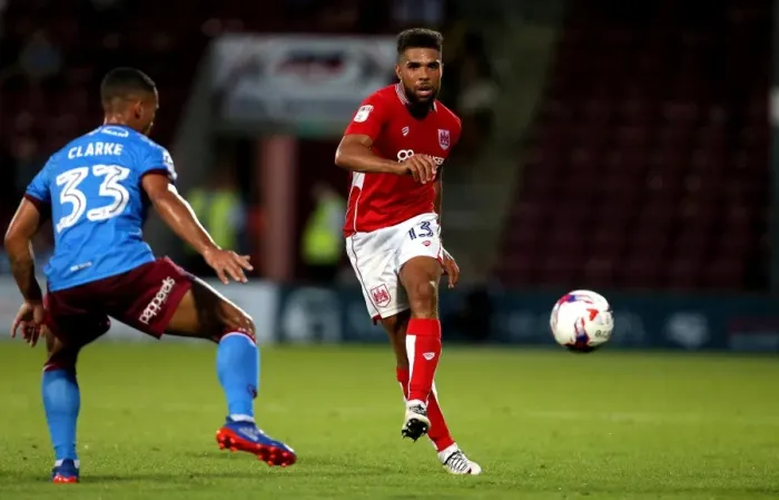 Framed Print : Bristol City's Scott Golbourne Evades Scunthorpe's Jordan Clarke in EFL Cup Clash Framed Print : Bristol City's Scott Golbourne Evades Scunthorpe's Jordan Clarke in EFL Cup Clash