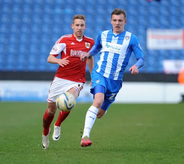 Framed Print : Bristol City's Scott Wagstaff Chases Down Colchester United's Alex Gilbey in Sky Bet League One Clash Framed Print : Bristol City's Scott Wagstaff Chases Down Colchester United's Alex Gilbey in Sky Bet League One Clash