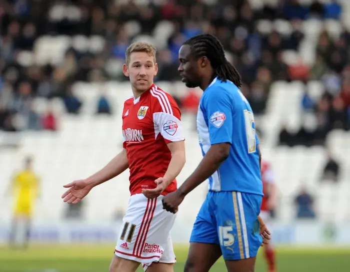 Framed Print : Bristol City's Scott Wagstaff and Colchester United's Marcus Bean Clash in Sky Bet League One Match