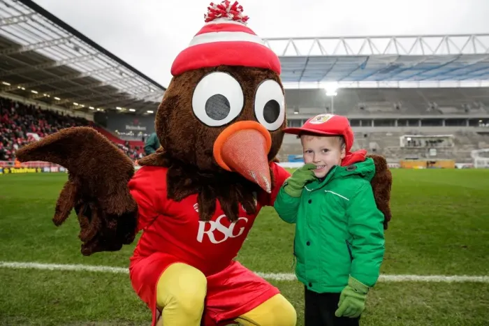 Framed Print : Bristol City's Scrumpy Mascot Surprises Young Fan with Cap at Half-Time