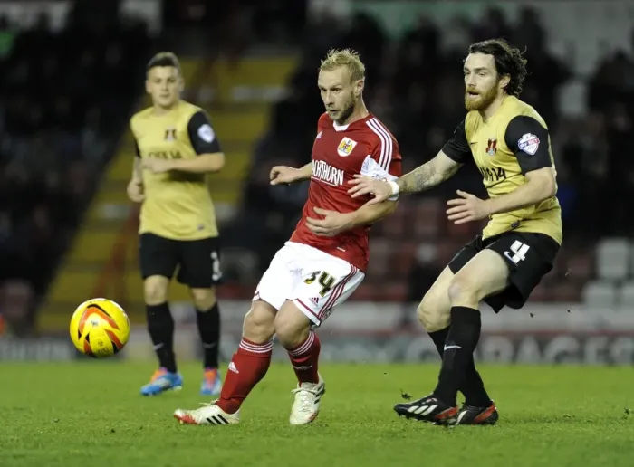 Framed Print : Bristol City's Simon Gillett Evades Challenge from Leyton Orient's Romain Vincelot