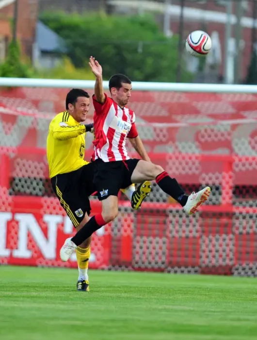 Framed Print : Bristol City's Stephen Henderson Clears Under Pressure Against Exeter City
