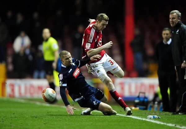 Bristol City's Stephen Pearson Dodges Alan Dunne's Tackle in Championship Clash between Bristol City and Millwall - 03 / 01 / 2012