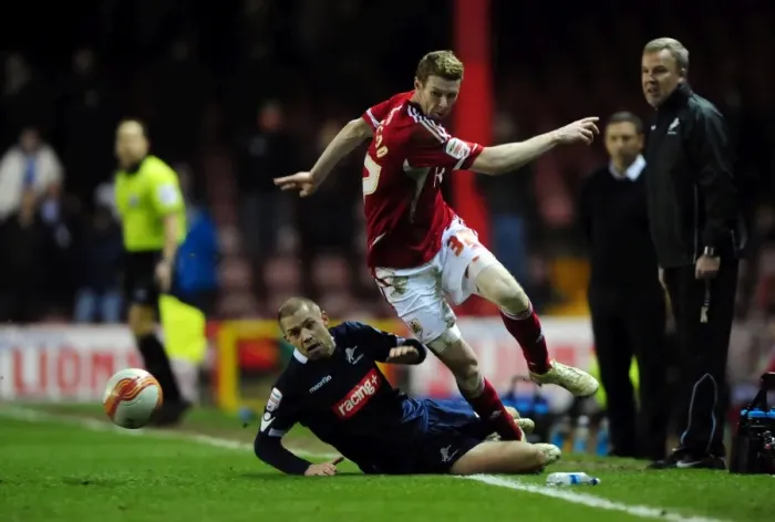 Framed Print : Bristol City's Stephen Pearson Dodges Tackle from Millwall's Alan Dunne - Championship Match (03 / 01 / 2012)