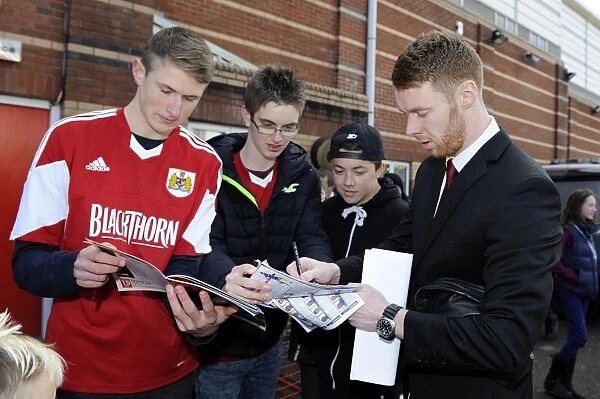 Bristol City's Stephen Pearson Greets Fans with Autographs After Match