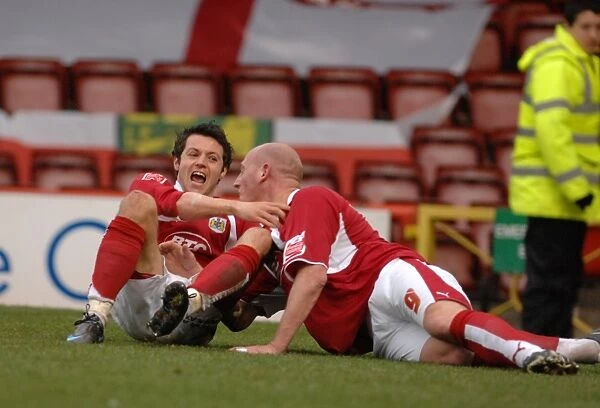 Bristol City's Steve Brooker and Ivan Sproule: A Jubilant Moment of Victory (vs. Norwich City)