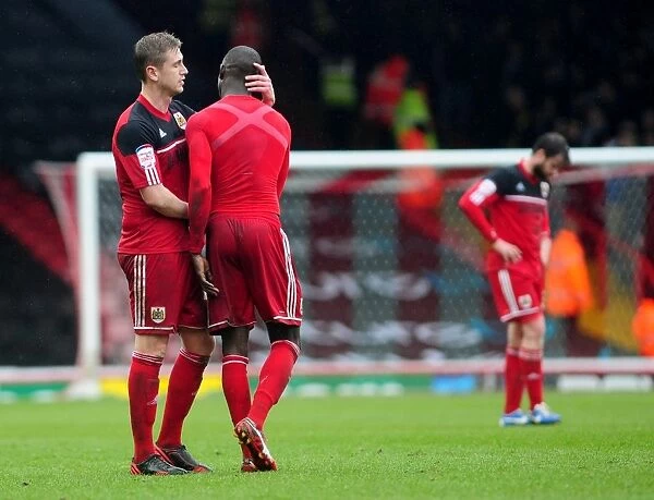 Bristol City's Steven Davies and Albert Adomah: A Moment of Reunion after the Final Whistle (Bristol City V Bolton Wanderers, Npower Championship)