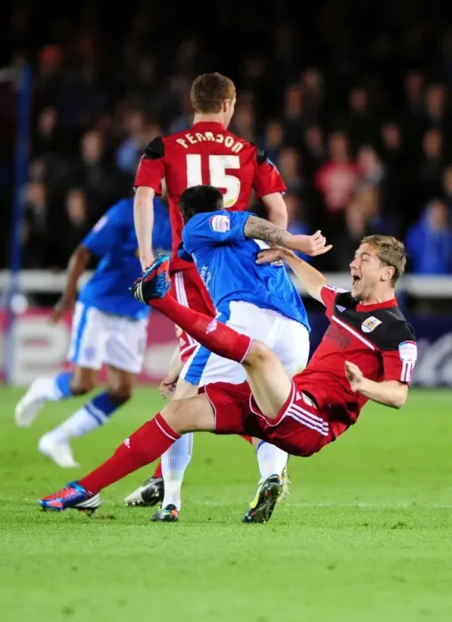 Framed Print : Bristol City's Steven Davies Fouled by Lee Tomlin in Peterborough United Championship Clash Framed Print : Bristol City's Steven Davies Fouled by Lee Tomlin in Peterborough United Championship Clash