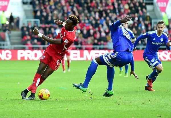 Bristol City's Tammy Abraham Outmaneuvers Cardiff City's Souleymane Bamba during Sky Bet Championship Match