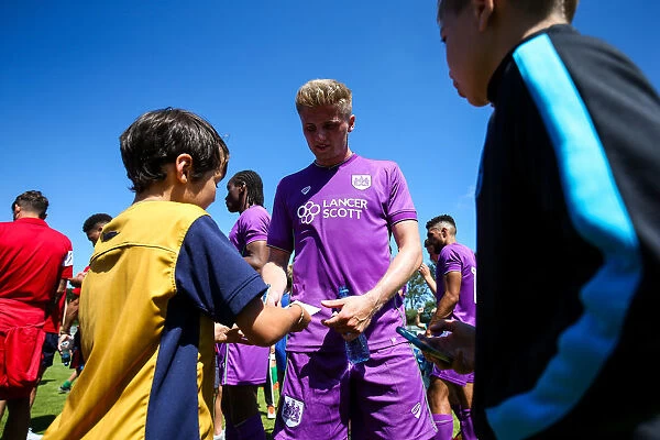 Bristol City's Taylor Moore Signs Autographs at Guernsey Friendly