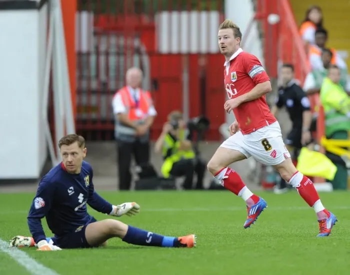 Framed Print : Bristol City's Thrilling Victory: Wade Elliott's Game-Winning Goal vs. MK Dons at Ashton Gate