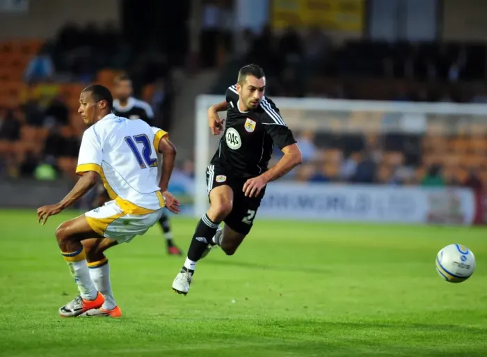 Framed Print : Bristol Citys trialist Tom Williams goes past the torquay defence
