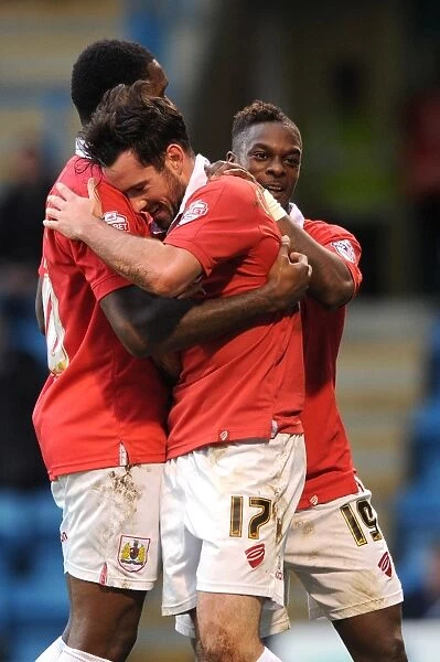 Bristol City's Triumph: Cunningham, Emmanuel-Thomas, and Agard Celebrate Goal in FA Cup Match against Gillingham
