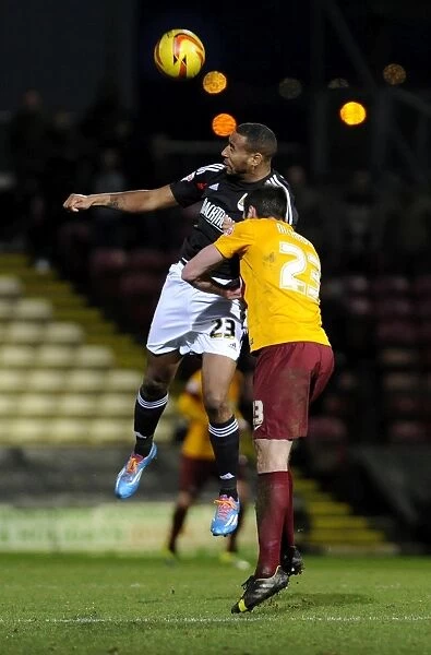 Bristol City's Tyrone Barnett Clashes with Rory McArdle of Bradford City - Football Rivalry in Action