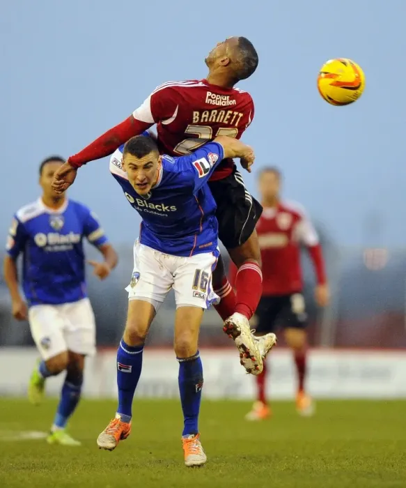 Framed Print : Bristol City's Tyrone Barnett Fights for Ball Against Oldham Athletic's James Wilson in Sky Bet League One Clash Framed Print : Bristol City's Tyrone Barnett Fights for Ball Against Oldham Athletic's James Wilson in Sky Bet League One Clash