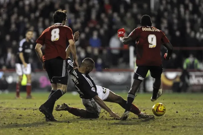 Framed Print : Bristol City's Tyrone Barnett vs. Brentford's Clayton Donaldson - Intense Football Rivalry at Griffin Park (January 2014)
