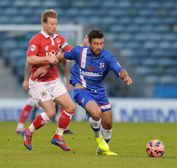 Bristol City's Wade Elliott Closes In on Gillingham's Michael Doughty during FA Cup Clash at Priestfield Stadium, 08 / 11 / 2014