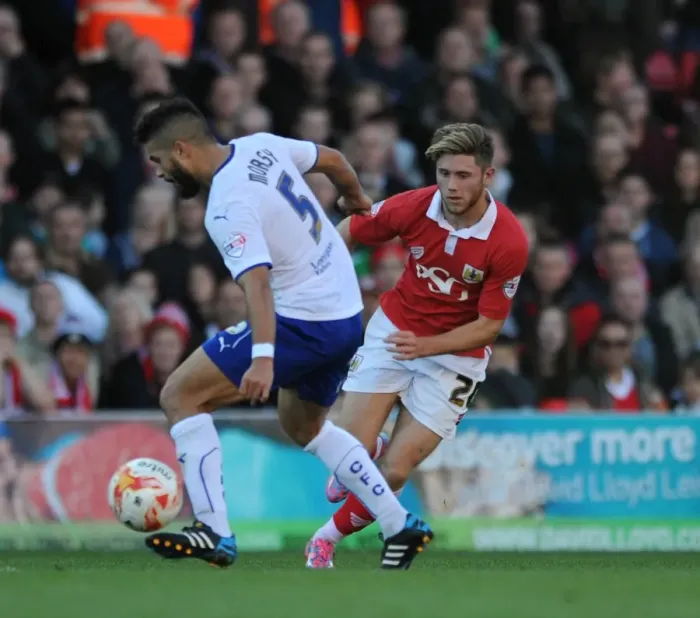 Framed Print : Bristol City's Wes Burns Evades Sam Morsy in Sky Bet League One Clash Framed Print : Bristol City's Wes Burns Evades Sam Morsy in Sky Bet League One Clash