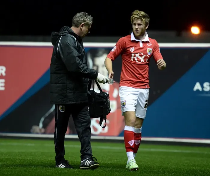 Framed Print : Bristol City's Wes Burns Injured Limps Off Pitch During Bristol City v AFC Wimbledon Match