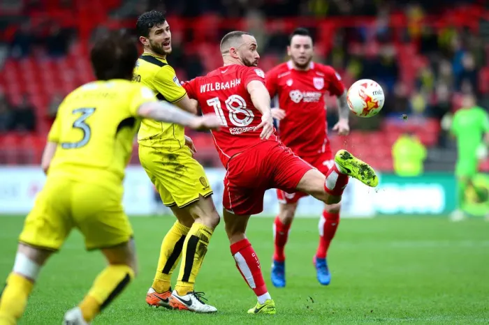 Framed Print : Bristol City's Wilbraham Fends Off Burton's Mousinho in Championship Clash