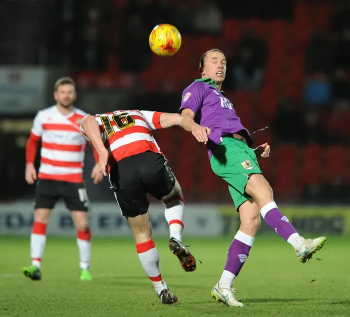 Framed Print : Bristol City's Wilbraham vs. Butler: Heading Battle at Doncaster's Keepmoat Stadium, 2015 Framed Print : Bristol City's Wilbraham vs. Butler: Heading Battle at Doncaster's Keepmoat Stadium, 2015