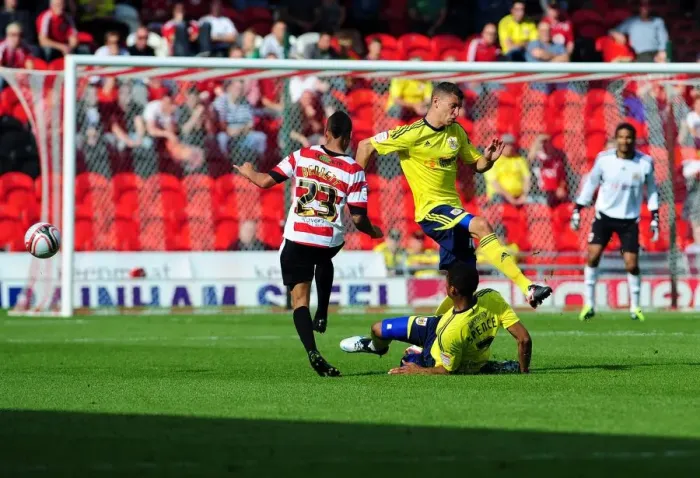 Framed Print : Bristol City's Wilson and Spence Clash with Doncaster's Bennett in League Cup Match, 2011 Framed Print : Bristol City's Wilson and Spence Clash with Doncaster's Bennett in League Cup Match, 2011