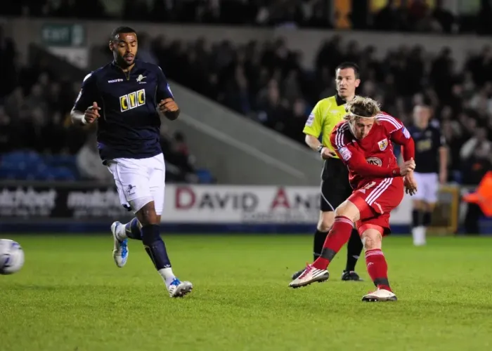 Framed Print : Bristol City's Woolford Thwarts by Millwall Keeper - Championship Clash, April 2011 Framed Print : Bristol City's Woolford Thwarts by Millwall Keeper - Championship Clash, April 2011