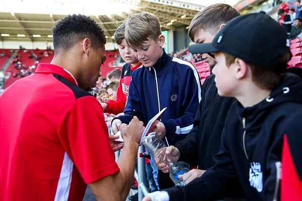 Bristol City's Zak Vyner Interacts with Fans, Signing Autographs at Ashton Gate Stadium