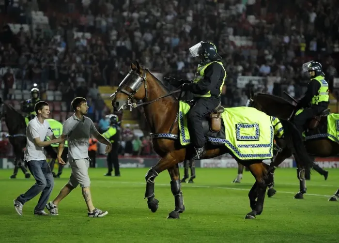 Framed Print : Bristol Derby Chaos: Fan Assaults Police Horse at Ashton Gate