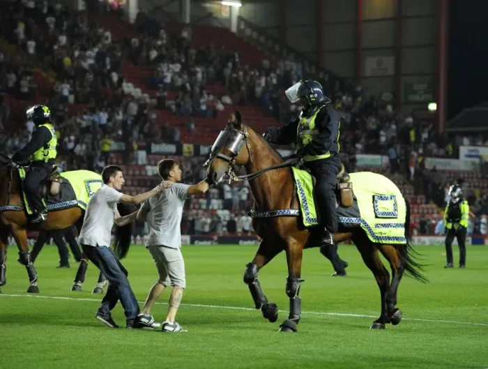 Framed Print : Bristol Derby Chaos: Fan Attacks Police Horse During Bristol City vs. Bristol Rovers Match Framed Print : Bristol Derby Chaos: Fan Attacks Police Horse During Bristol City vs. Bristol Rovers Match