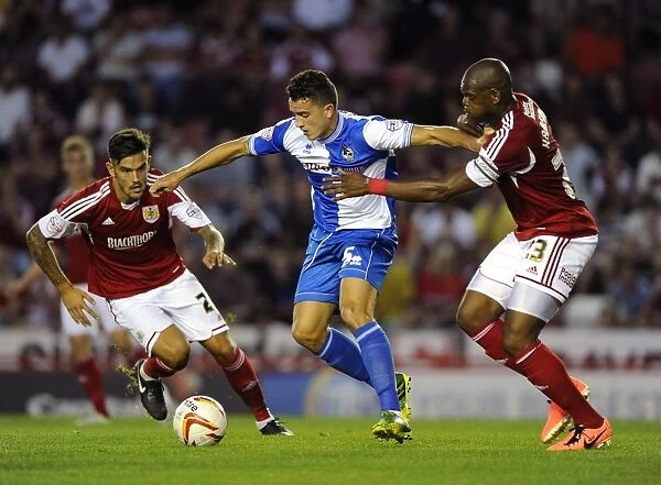 Bristol Derby: Intense Battle Between Marlon Harewood (Bristol City) and Oliver Norburn (Bristol Rovers) in the Johnstone Paint Trophy First Round at Ashton Gate, 2013