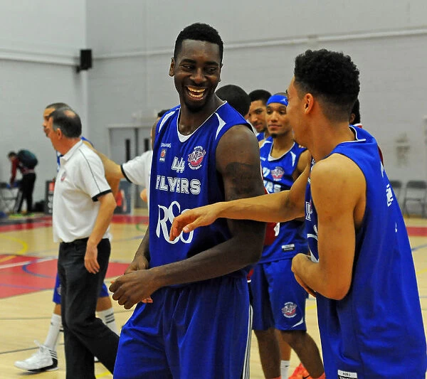 Bristol Flyers: Alif Bland Shares a Laugh with Teammate During Basketball Match Against Sheffield Sharks