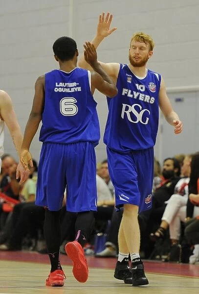 Bristol Flyers Celebrate Victory over Plymouth Raiders in Basketball Match