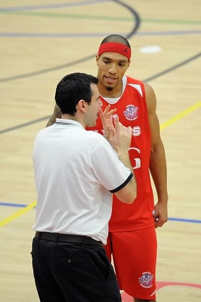 Bristol Flyers Coach Andreas Kapoulas Conferring with Greg Streete During Game vs Cheshire Phoenix