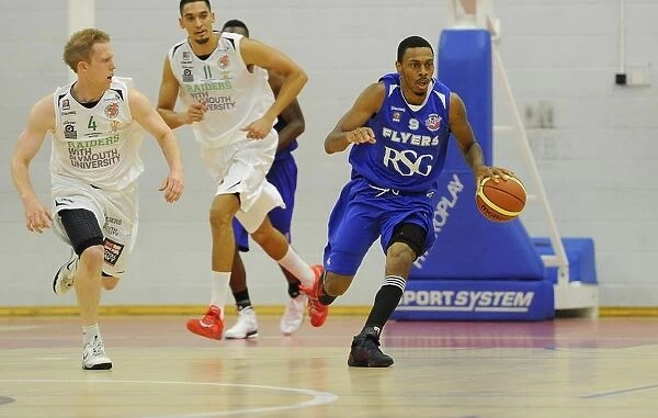 Bristol Flyers Doug Herring Drives Forward in Basketball Action Against Plymouth Raiders