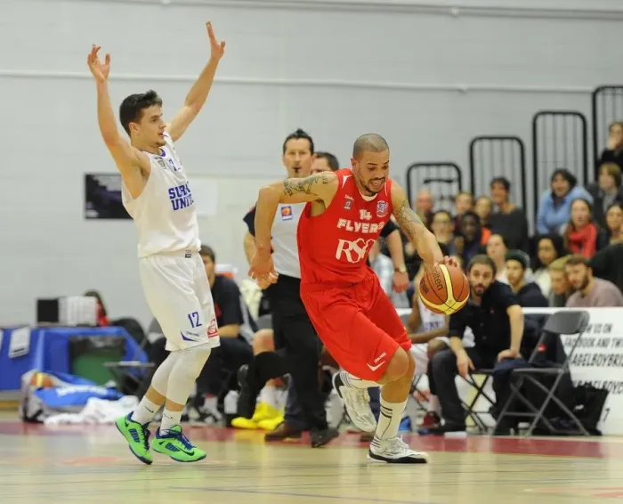 Framed Print : Bristol Flyers Doug McLaughlin-Williams Charges Forward Against Surrey United in Basketball Action Framed Print : Bristol Flyers Doug McLaughlin-Williams Charges Forward Against Surrey United in Basketball Action