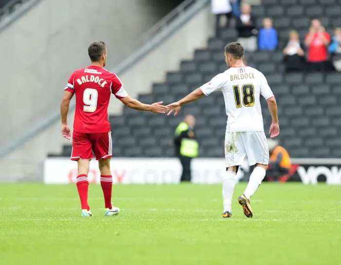 Framed Print : Brothers in Football: A Heartwarming Moment of Celebration Framed Print : Brothers in Football: A Heartwarming Moment of Celebration