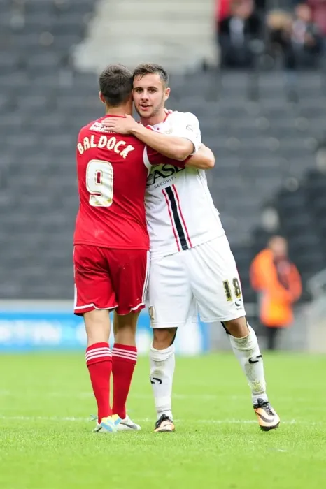 Framed Print : Brothers in Football: Sam and George Baldock's Emotional Reunion after Milton Keynes Dons vs. Bristol City Framed Print : Brothers in Football: Sam and George Baldock's Emotional Reunion after Milton Keynes Dons vs. Bristol City