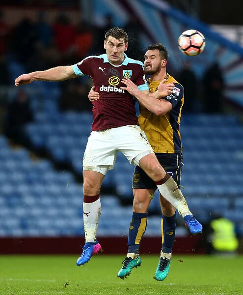 Burnley's Sam Vokes and Bailey Wright of Bristol City Clash in FA Cup Fourth Round at Turf Moor