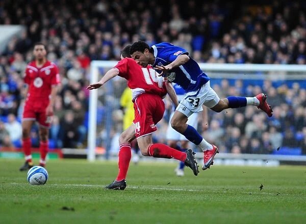 Carlos Edwards tussles with Cole Skuse