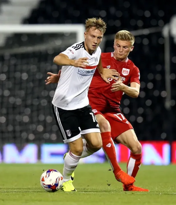 Framed Print : Cauley Woodrow vs Taylor Moore: A Battle at Craven Cottage - Fulham vs Bristol City EFL Cup Clash