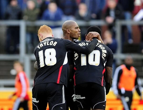 Celebrating Glory: Jay Emmanuel-Thomas, Marvin Elliott, and Ryan Taylor's Unforgettable Moment after Scoring for Bristol City against Carlisle United (26th October 2013)
