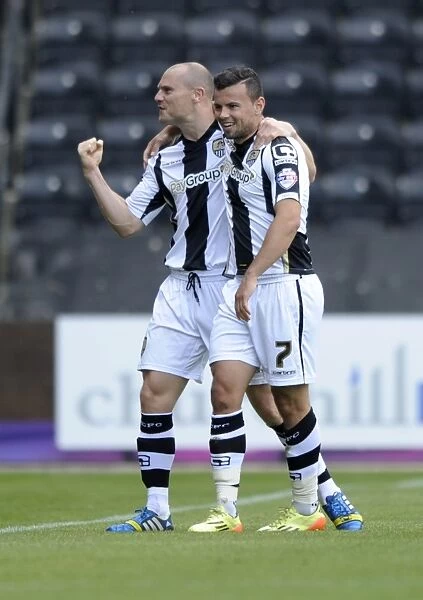 Celebrating Glory: Zeli Ismail and Gary Jones of Notts County Rejoice in Their Team's Goal Against Bristol City (August 31, 2014)