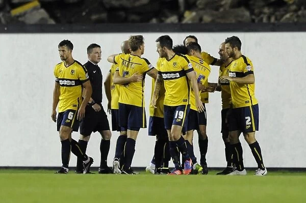 Celebrating the Goal: Oxford United's Danny Hylton and Team Mates Rejoice after Scoring against Bristol City