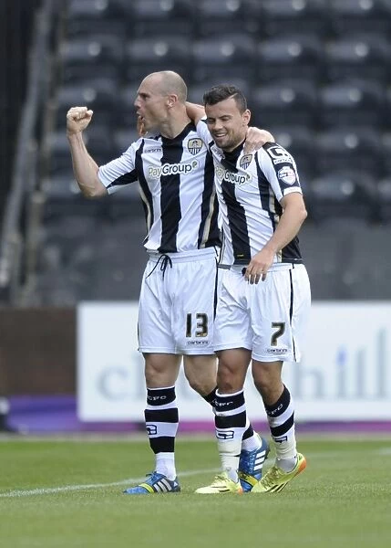 Celebrating Together: A Unique Moment between Zeli Ismail and Gary Jones during Notts County vs. Bristol City, August 2014
