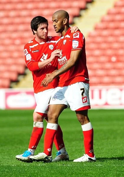 Celebration: Barnsley's Haynes and Butterfield Rejoice in Championship Victory over Bristol City (09 / 04 / 2011)