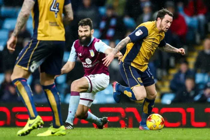 Framed Print : Challenge at Villa Park: Lee Tomlin vs Mile Jedinak (Aston Villa vs Bristol City, Sky Bet EFL Championship)