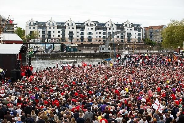 Champions Triumph: Throngs of Fans Celebrate Bristol City's League 1 and Johnstones Paint Trophy Titles with Open Top Bus Parade