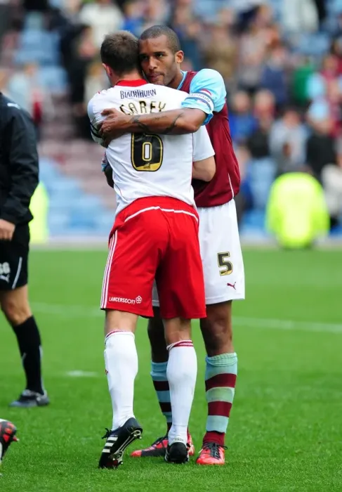 Framed Print : Championship Clash: Burnley and Bristol City Captains Embrace Victory at Turf Moor (August 2010)