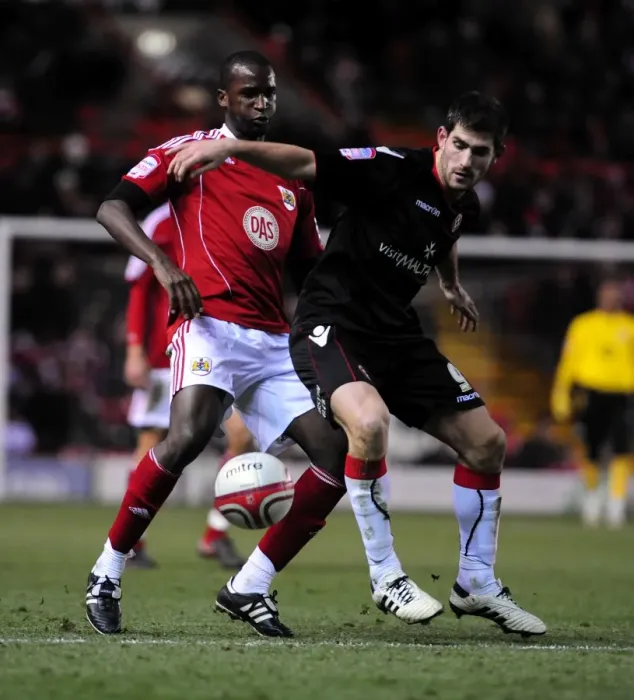 Framed Print : Championship Showdown: Cisse vs Evans - Intense Battle for Ball Possession (Bristol City vs Sheffield United) Framed Print : Championship Showdown: Cisse vs Evans - Intense Battle for Ball Possession (Bristol City vs Sheffield United)